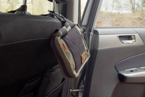 BROG EDC pouch attached to a headrest via carabiner