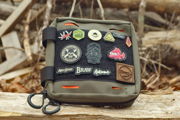 BROG EDC pouch with the front velcro field covered in various patches