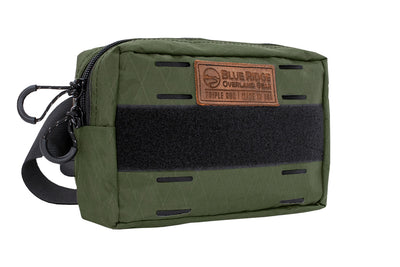 Bum Bag XL in Olive Green - front angled, with leather BROG tag and velcro 