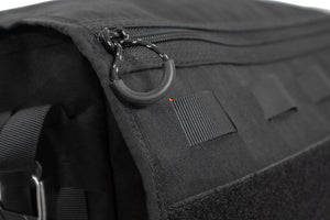 Up close view of zipper slider on outside, front  pocket