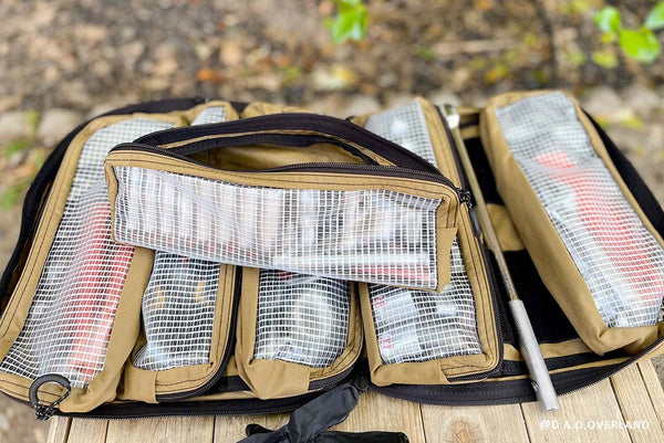 Customer-submitted photo of a BROG Tool Bag open outdoors with clear-front pouches organizing tools and gear.