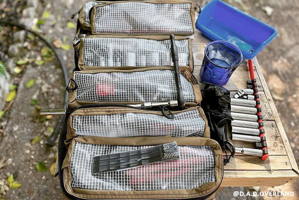 Customer-submitted photo of a BROG Tool Bag open outdoors with clear-front pouches organizing tools and gear.