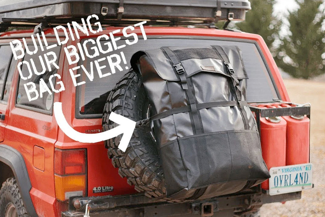 The Tire Storage Bag XL  on the back of a red Jeep with the words 'Building our biggest bag ever!'