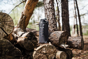 Black Bear Spray holder in wooded scene
