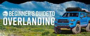 Beginner's Guide To Overlanding, with blue Tacoma parked in green field