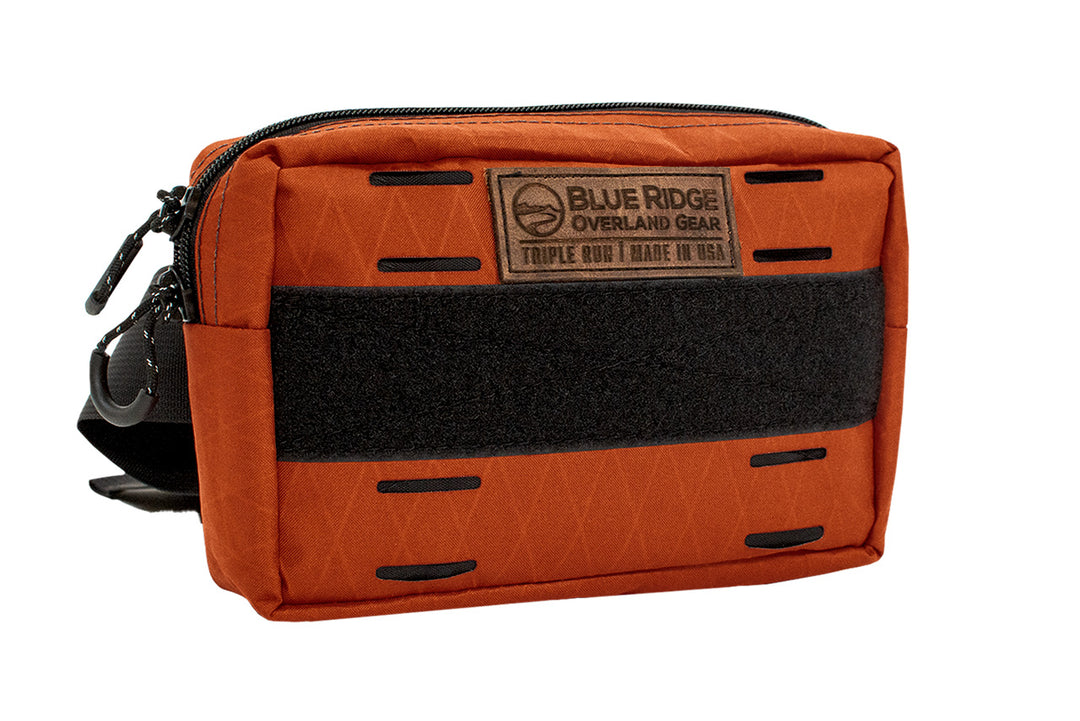 Bum Bag XL in Cayenne Orange - front angled, with leather BROG tag and velcro 