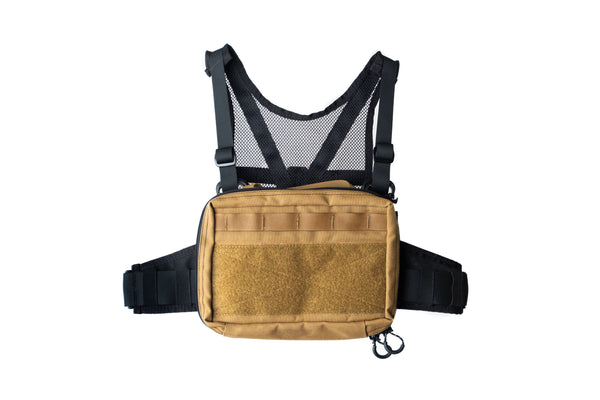 Tan tactical vest with black straps on a white background