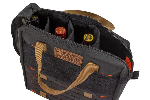 Open Speakeasy Bourbon Bag by Blue Ridge Overland Gear showing padded interior dividers holding three liquor bottles.