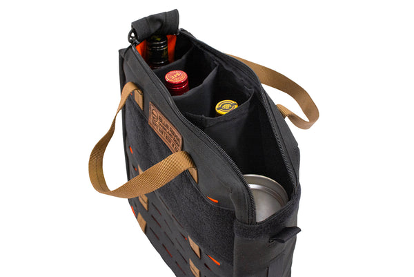 Angled view of the open Blue Ridge Overland Gear Speakeasy Bourbon Bag with padded dividers holding liquor bottles and drinkware.