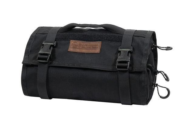 Black BROG Tool Pouch Roll rolled and secured with two adjustable buckle straps, carry handle, leather Blue Ridge Overland Gear patch, and multiple zipper pulls.