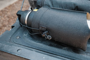 Black bag attached to a vehicle's luggage compartment