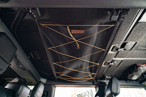 Bronco attic hooked onto Bronco roof, providing extra storage space