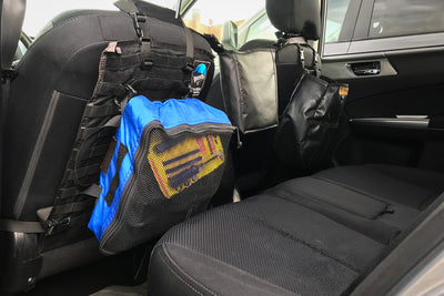 Mesh Packing Cube hanging on a Seat Back Panel by carabiners.