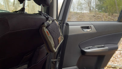 BROG EDC pouch attached to a headrest via carabiner