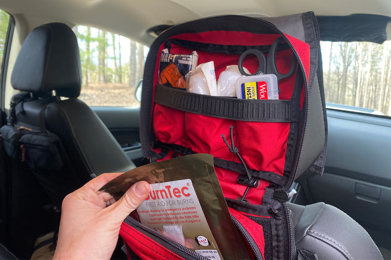 Small IFAK 2.0 - attached via Headrest Panel in vehicle and loaded with First Aid supplies