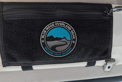The Blue Ridge Overland Gear "Reclaim Your Journey" Morale Patch stuck to a Velcro Visor Organizer