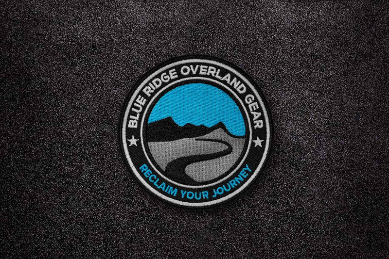 Blue Ridge Overland Gear Morale Patch stuck to Velcro. It says Reclaim your Journey across the bottom