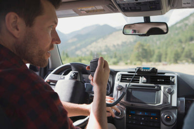 MXT115 15-Watt TWO-WAY GMRS RADIO being used in the cab of a full sized vehicle