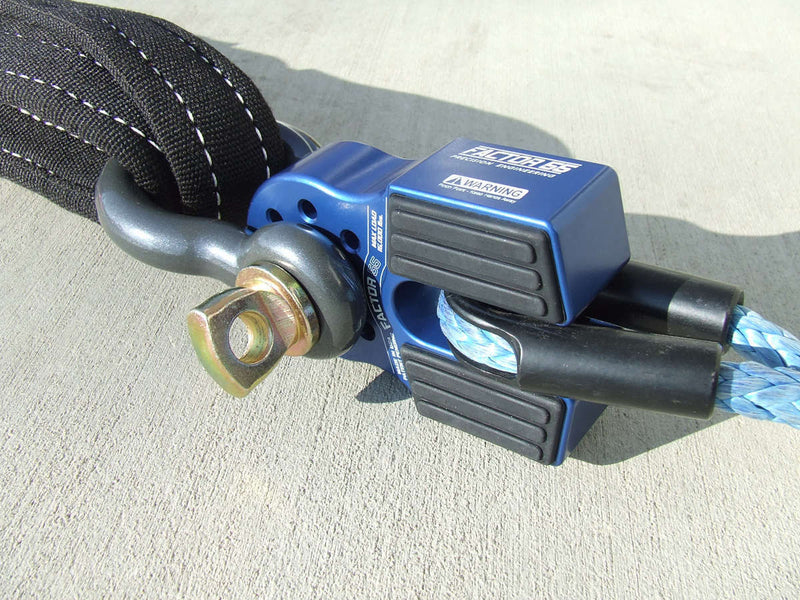 FACTOR 55 FlatLink Low Profile Shackle Mount Blue attached to a winch line on one end and a tow bow shackle on the other.
