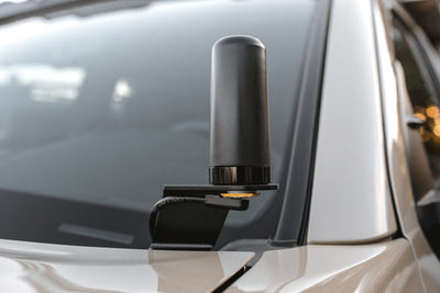 Midland MXTA25 3DB Gain GMRS Low Profile GHOST Antenna installed on a vehicle hood with a bracket