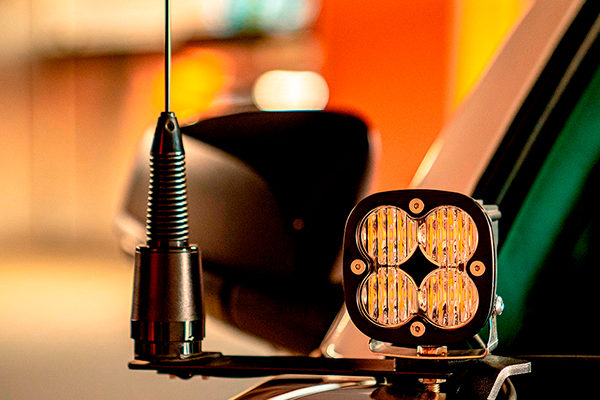 Midland MXTA26 6DB Gain GMRS Whip Antenna Installed on a bar bracket next to an led light