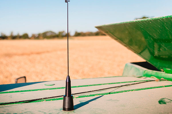 Midland MXTA26 6DB Gain GMRS Whip Antenna installed on a roof via a drilled hole