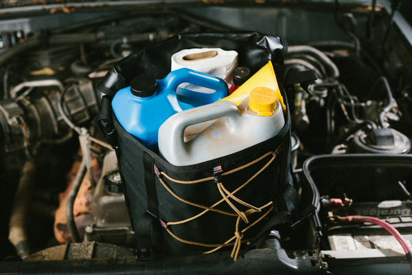 Overland Oil Bag up close with vehicle fluids  - Blue Ridge Overland Gear
