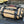 Coyote BROG Tool Pouch Roll labeled “Hand Tools” on a vehicle with wrenches and sockets laid out beside it, ready for vehicle maintenance.