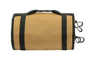 Rear view of rolled coyote BROG Tool Pouch Roll showing durable fabric construction, reinforced black webbing, carry handle, and multiple zipper pulls.