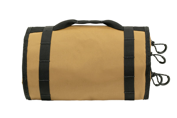 Rear view of rolled coyote BROG Tool Pouch Roll showing durable fabric construction, reinforced black webbing, carry handle, and multiple zipper pulls.
