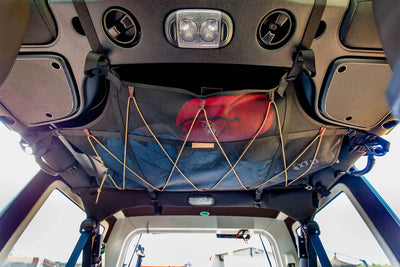 Jeep JKU Attic hooked onto roof and loaded up with gear